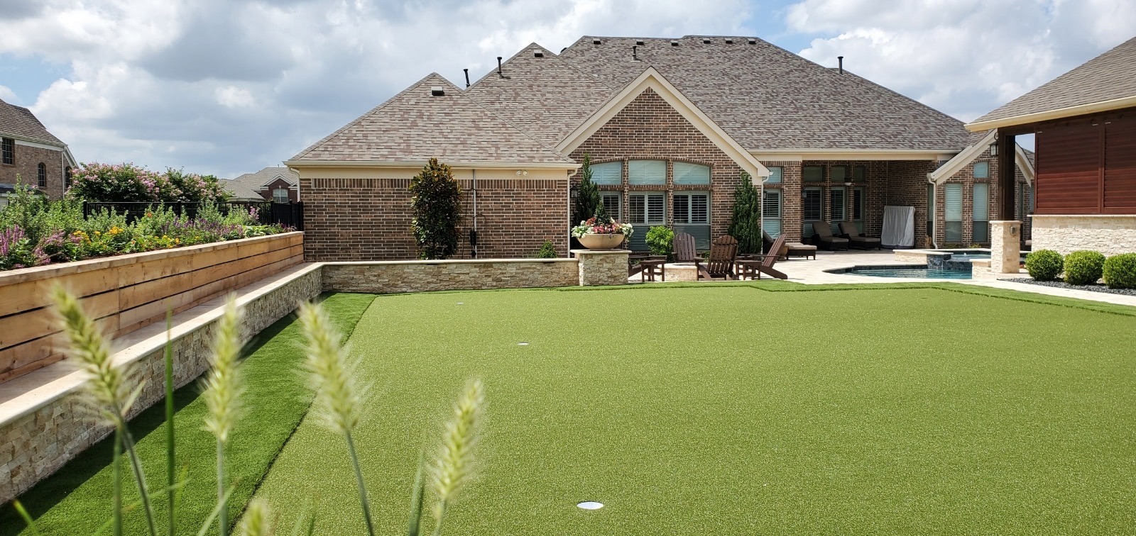 Backyard with lawn, patio, and pool