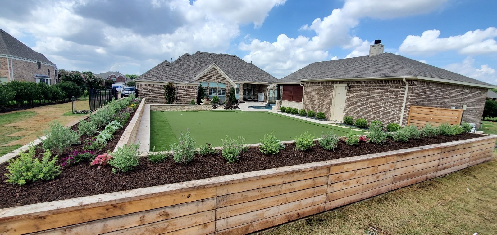 Backyard with garden, patio, and small pool