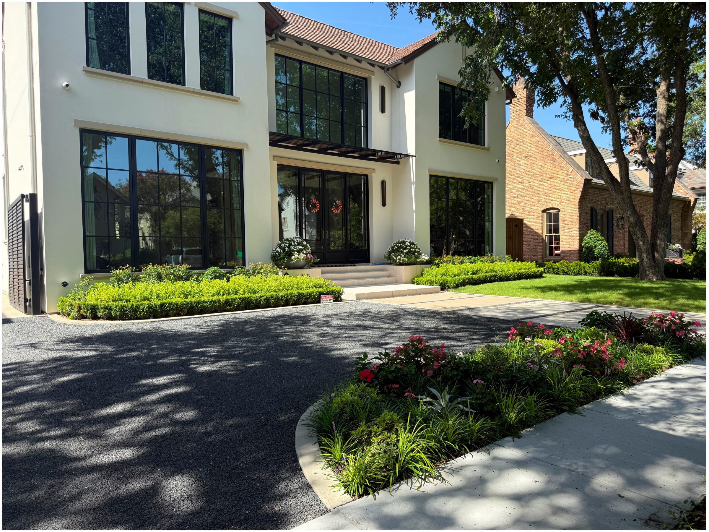 Modern house exterior with garden and trees