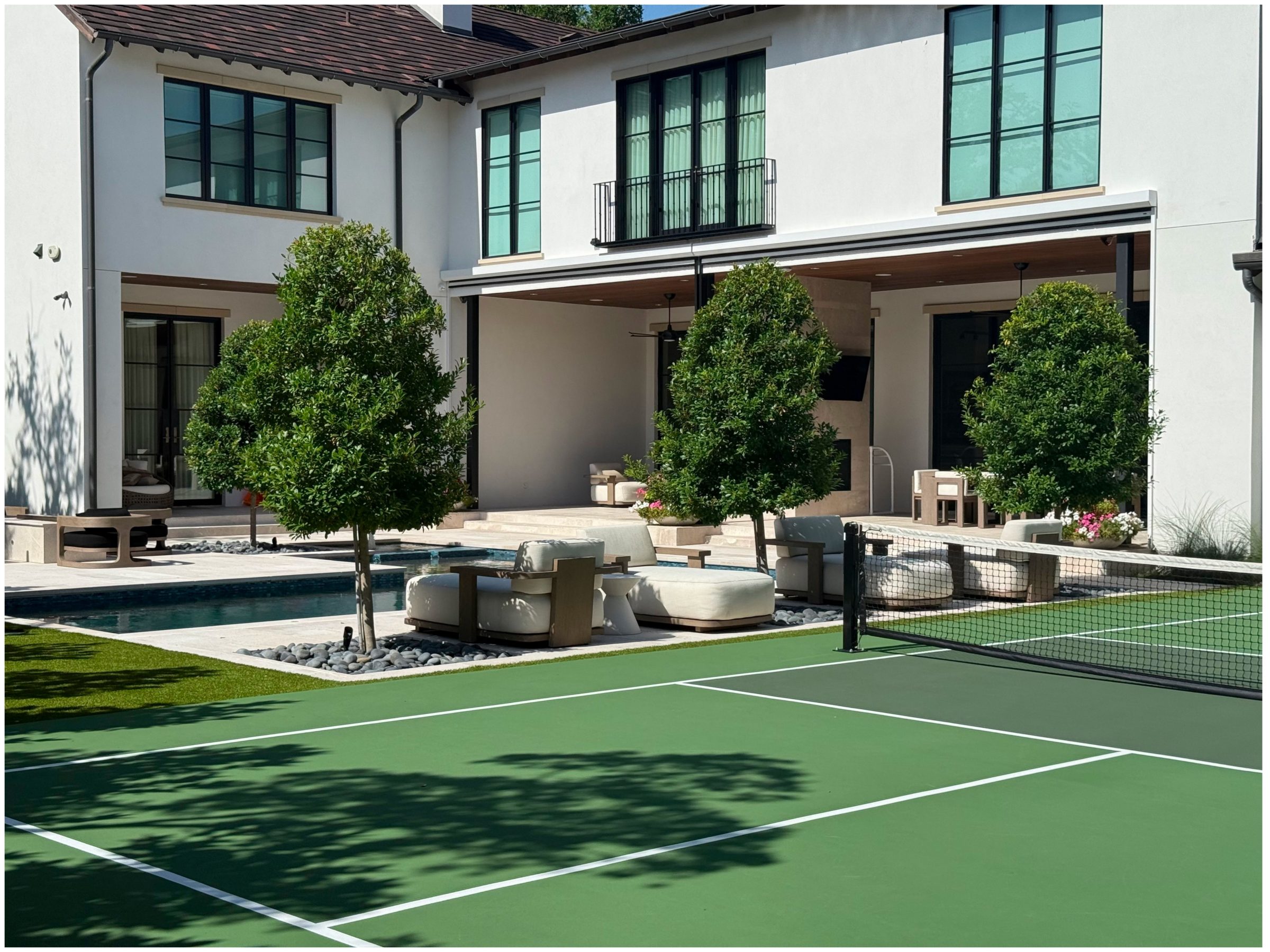 Luxury home with pool and tennis court.